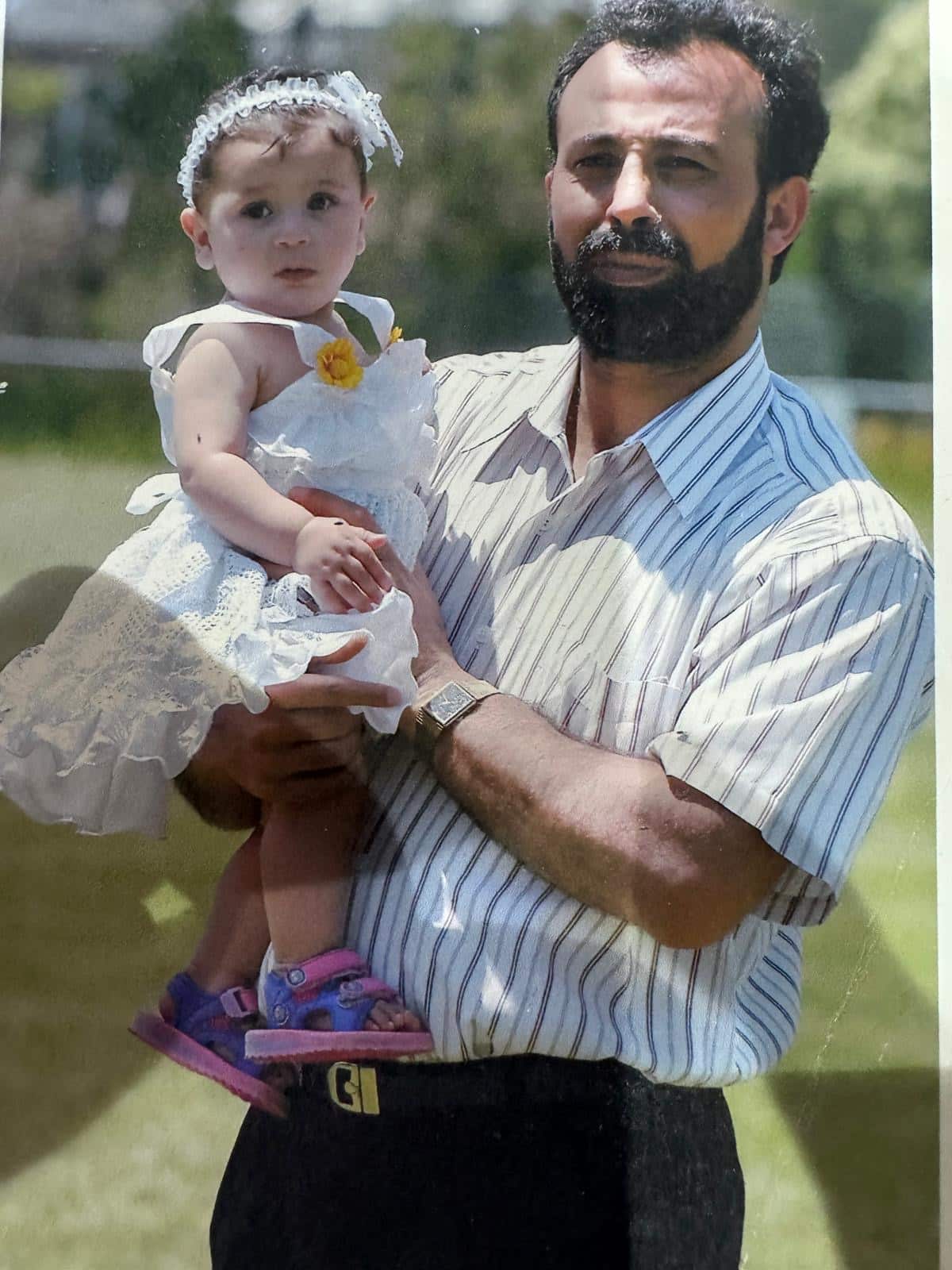 Mohammed Al-Omari with his youngest daughter.JPG