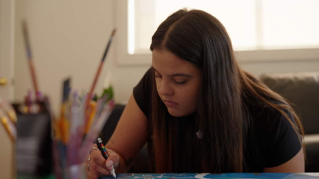 A woman painting.