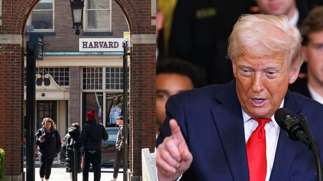 Donald Trump wearing a blue suit, pointing a finger