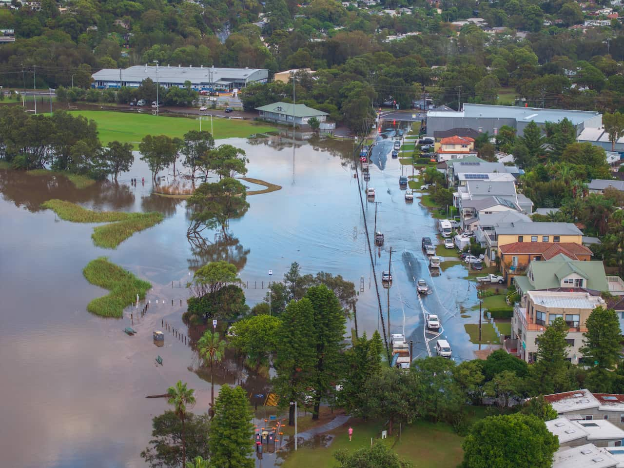 An aerial shot of parklands flooded near a NSW town.