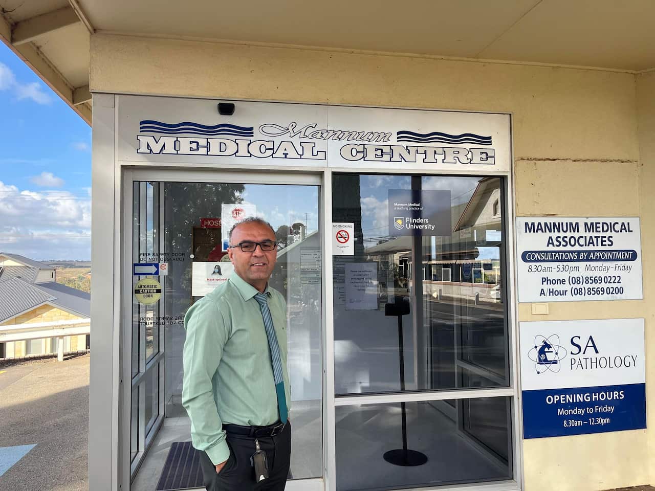 Dr Hamoudi outside climic.jpg
