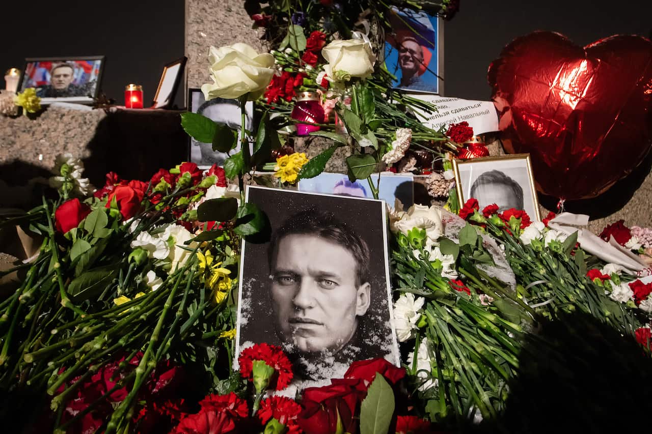 A memorial of flowers and pictures of Alexei Navalny