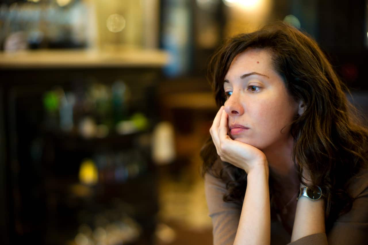 Brunette woman looking sad