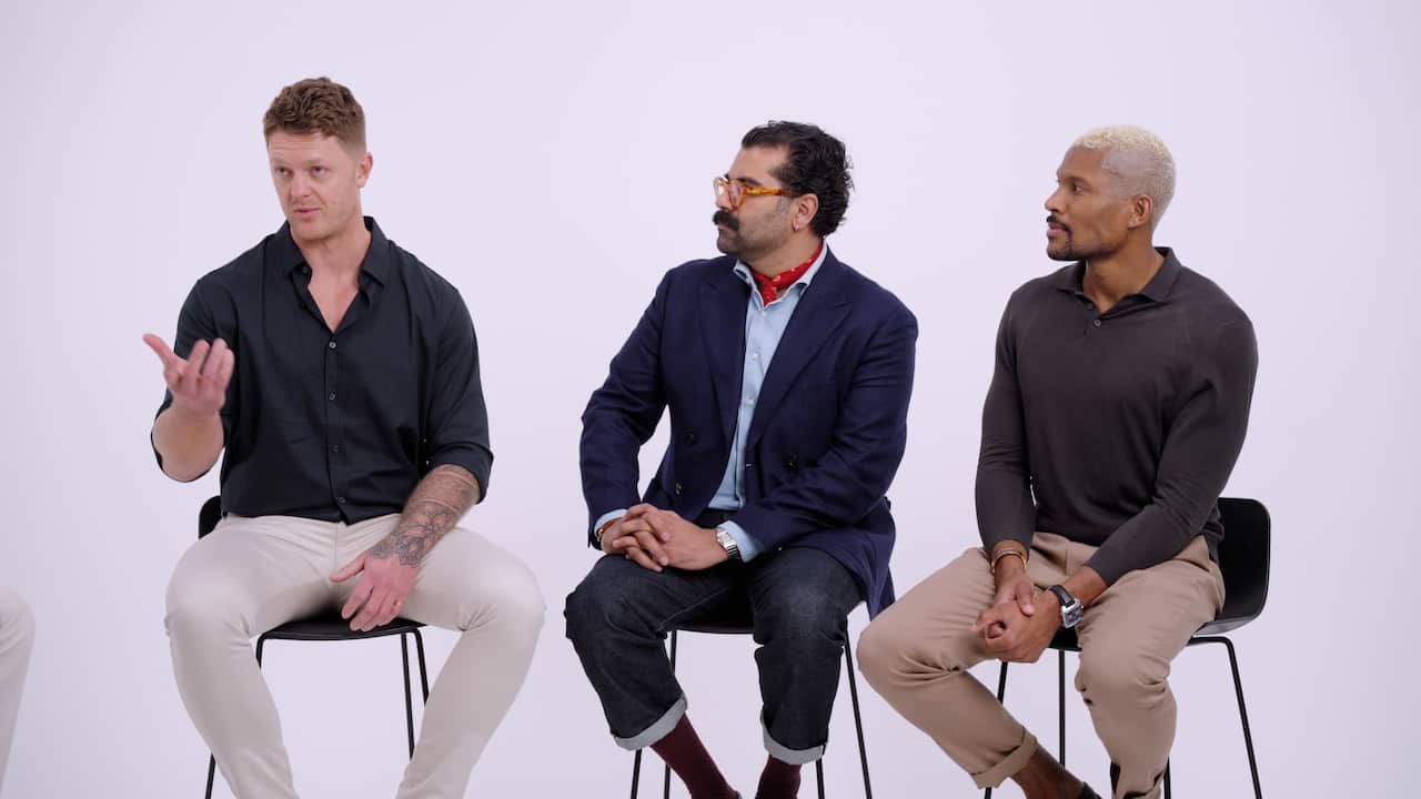 Three men sitting in a line.