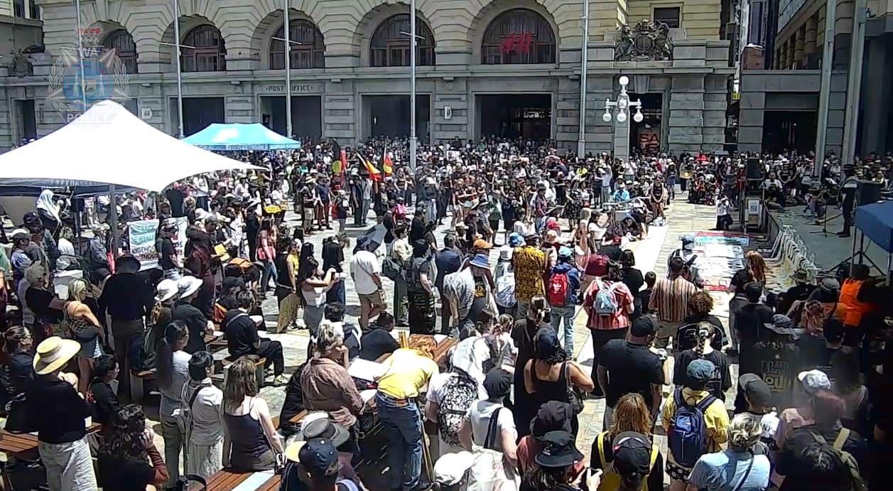A group of First Nations people rallying in a public square