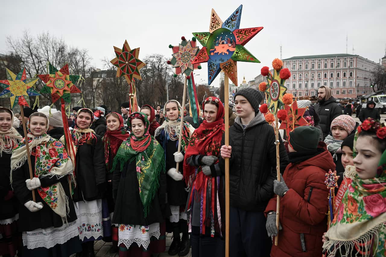 Kyiv, Ukraine: Hundreds of Kyiv residents attend the second annual Christmas Star Parade on Christmas Day. 