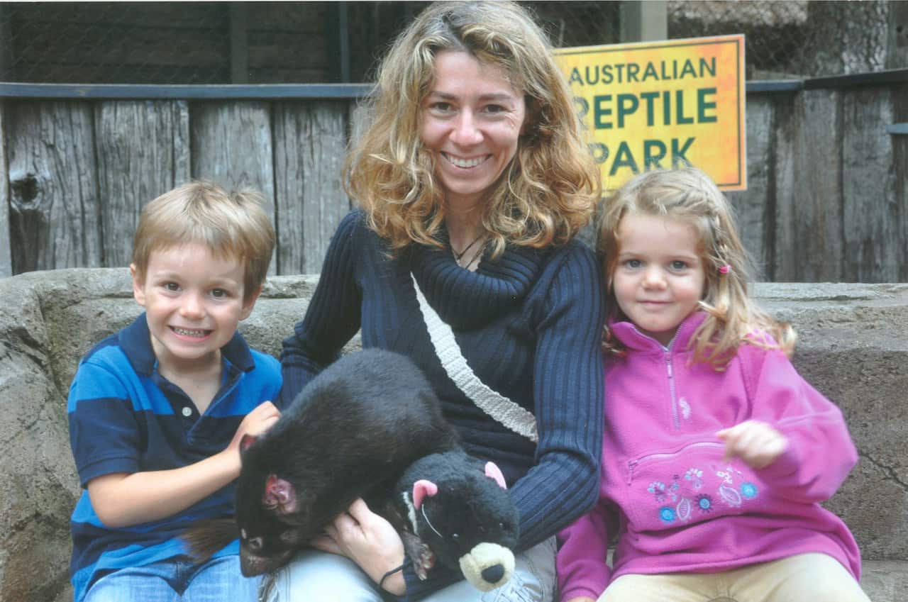 Orsola De Marco with her children Elliot and Chiara and a Tasmanian devil in a photo from 2011.