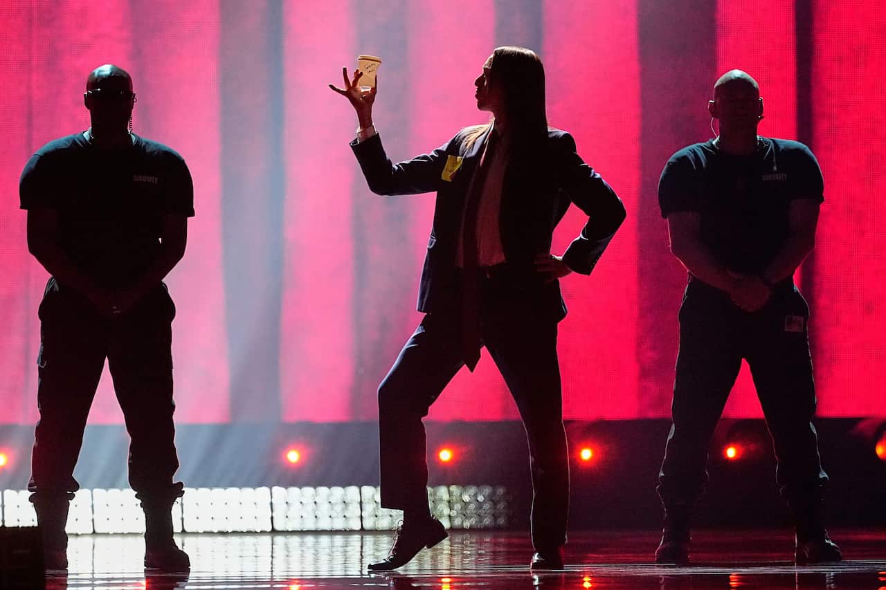 Tommy Cash from Estonia, center, performs on stage