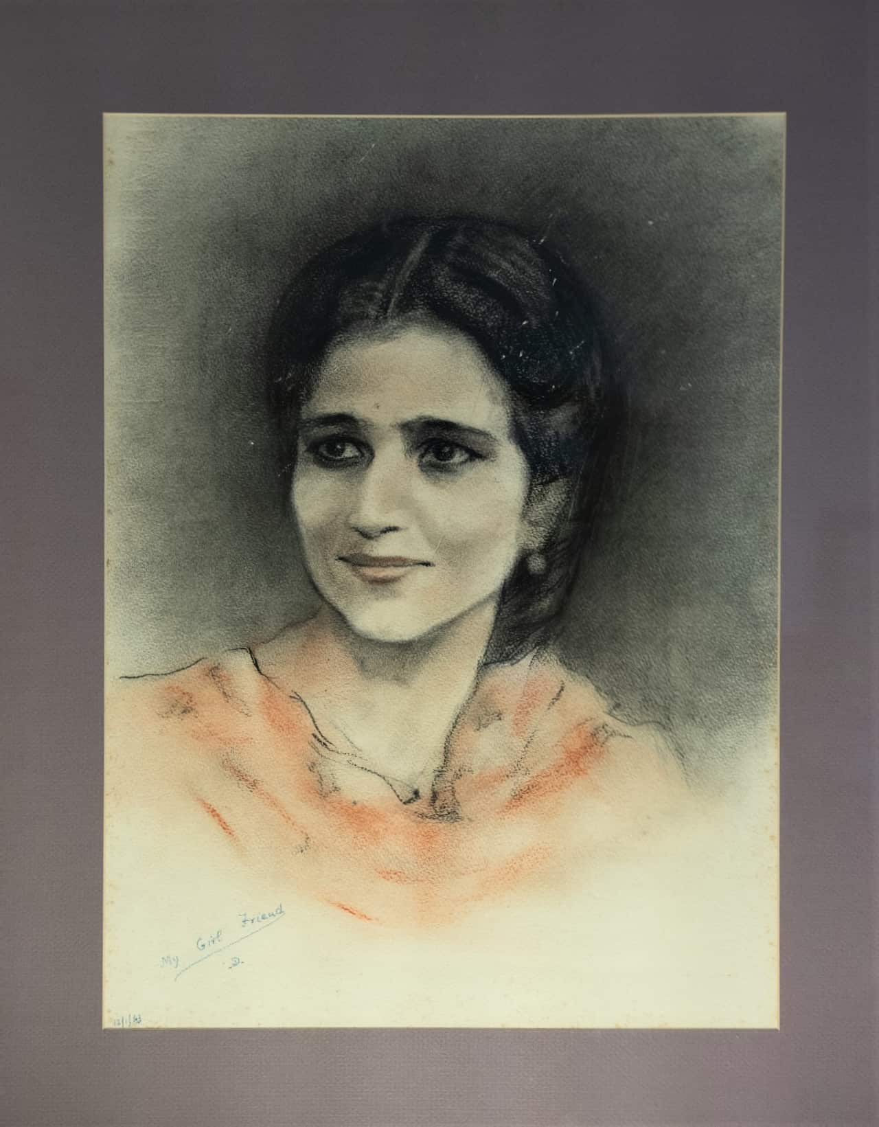 A portrait of a young woman with black hair.