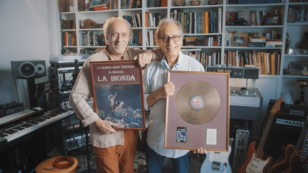 The La Bionda Brothers posing with a Gold Record (Disco d'Oro)