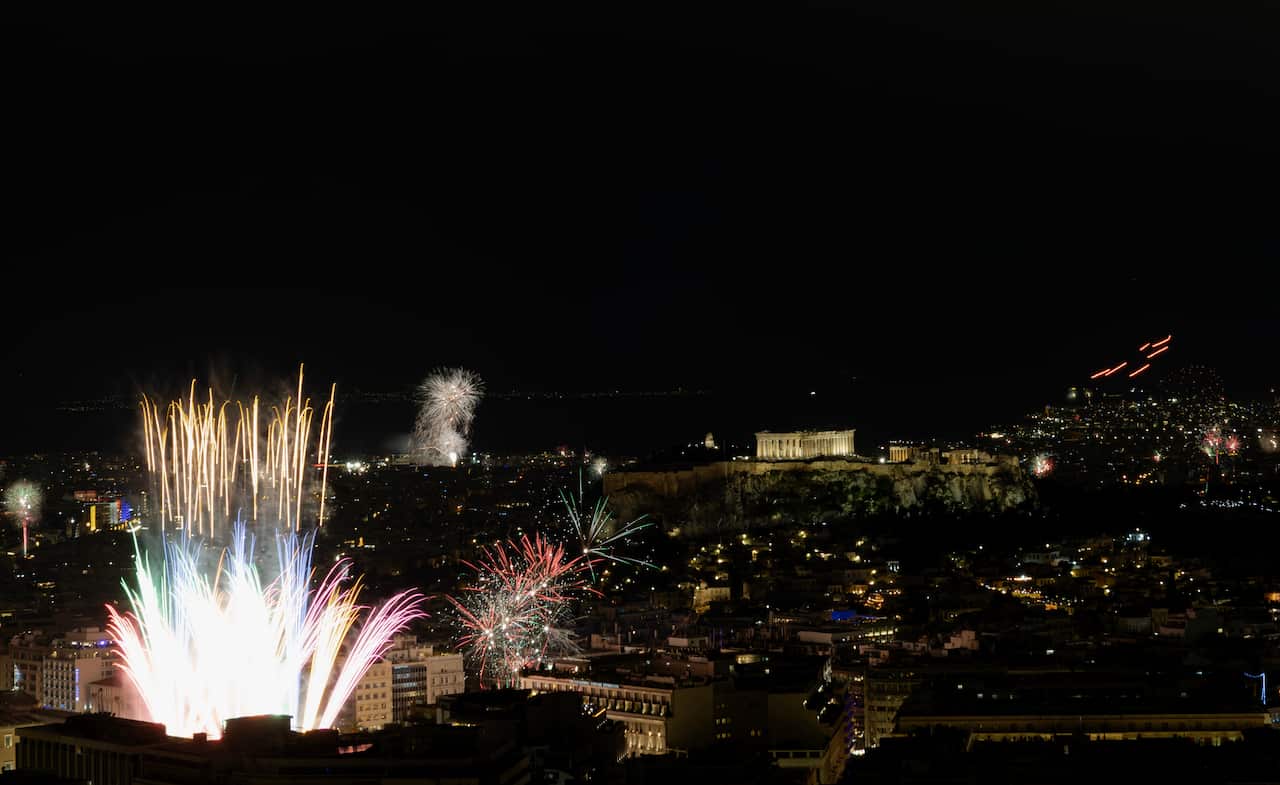 Fireworks over Athens, with the Parthenon lit up.