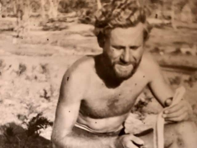 Sisto Ruchin skinning a snake in 1957.