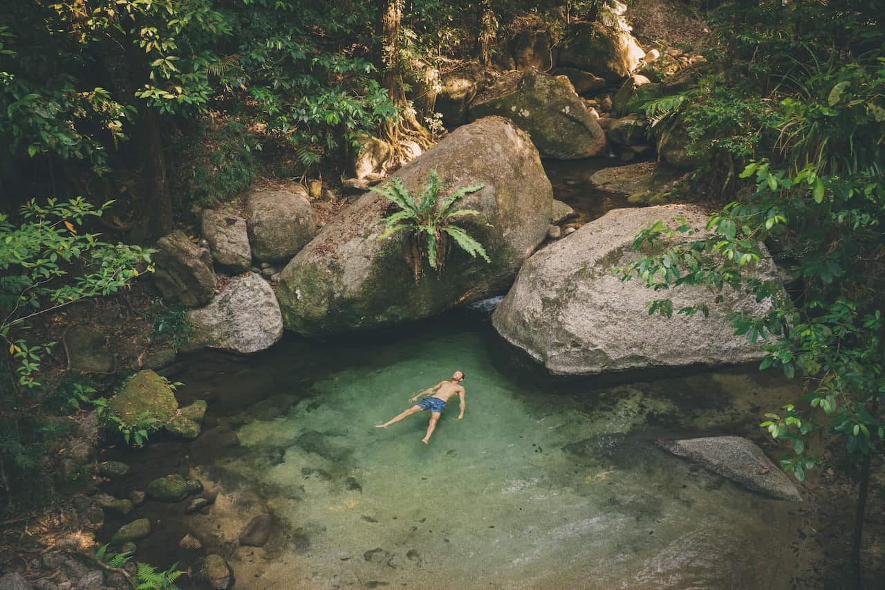 Mossman gorge swimming tourist