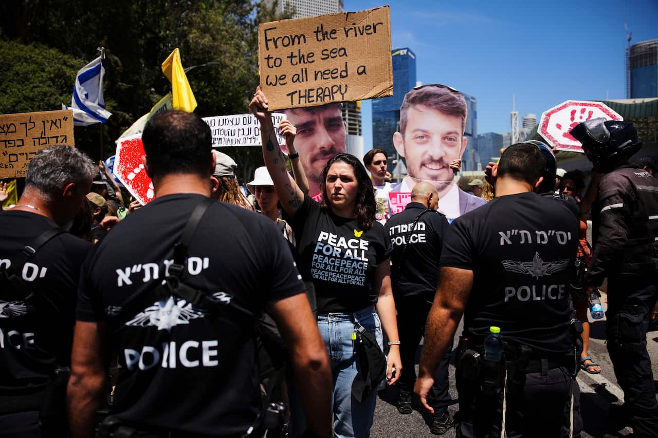 Demonstrators block a road during a protest