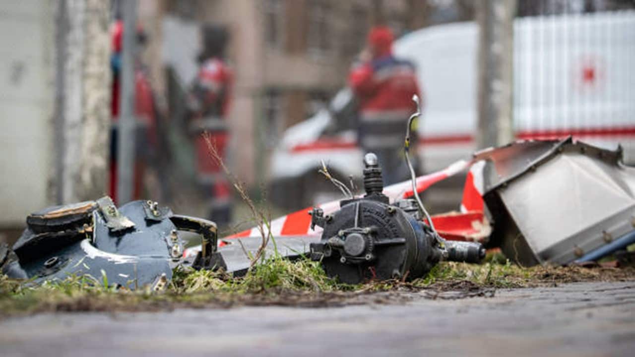 Fragments of the helicopter lie on the playground at the site of a helicopter crash .jpg