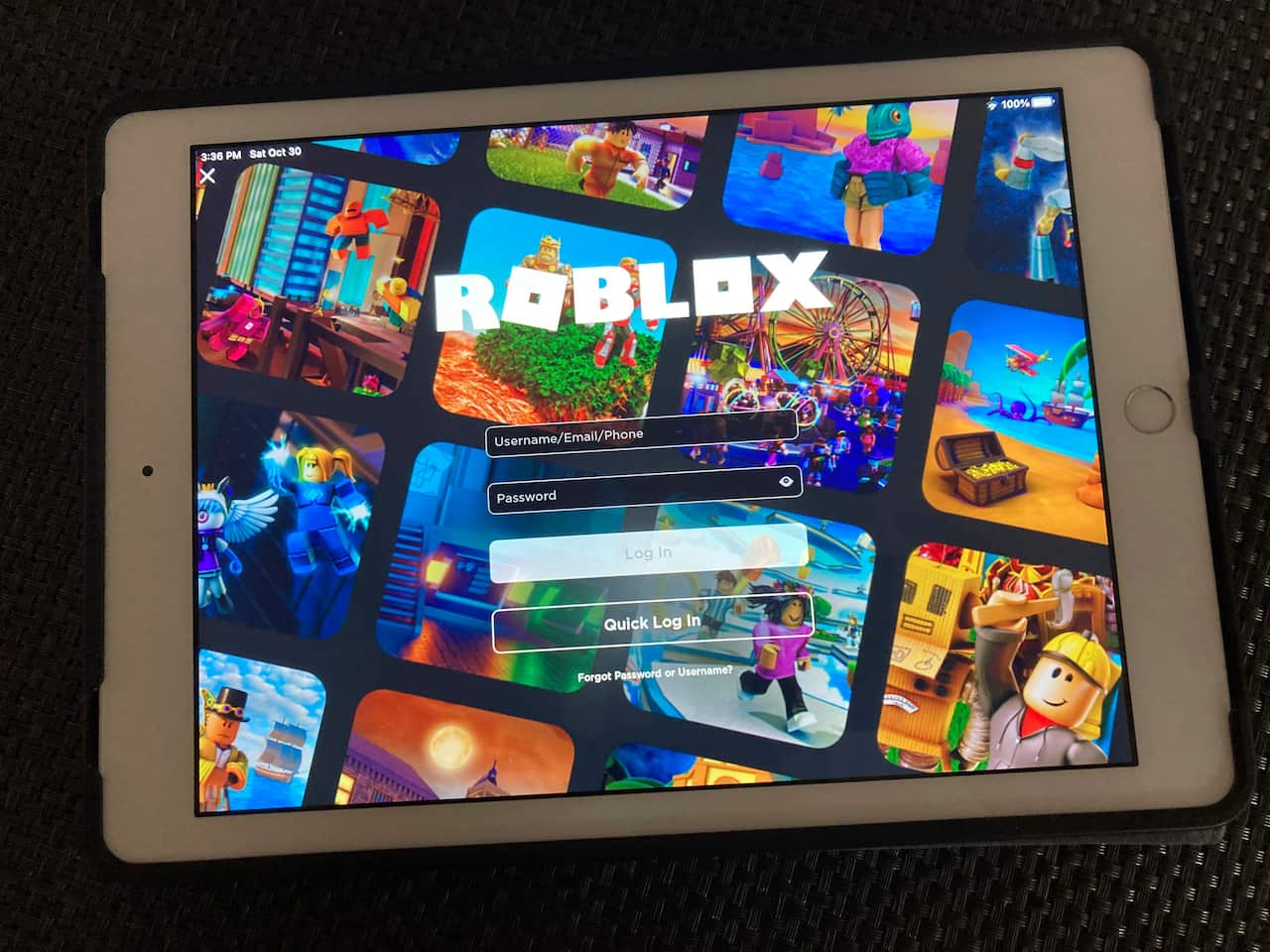 A tablet with a login screen for Roblox.