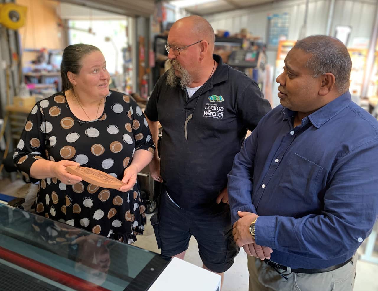Mick Harding (centre) with his wife Nicole (left) and IBA's David Deo 