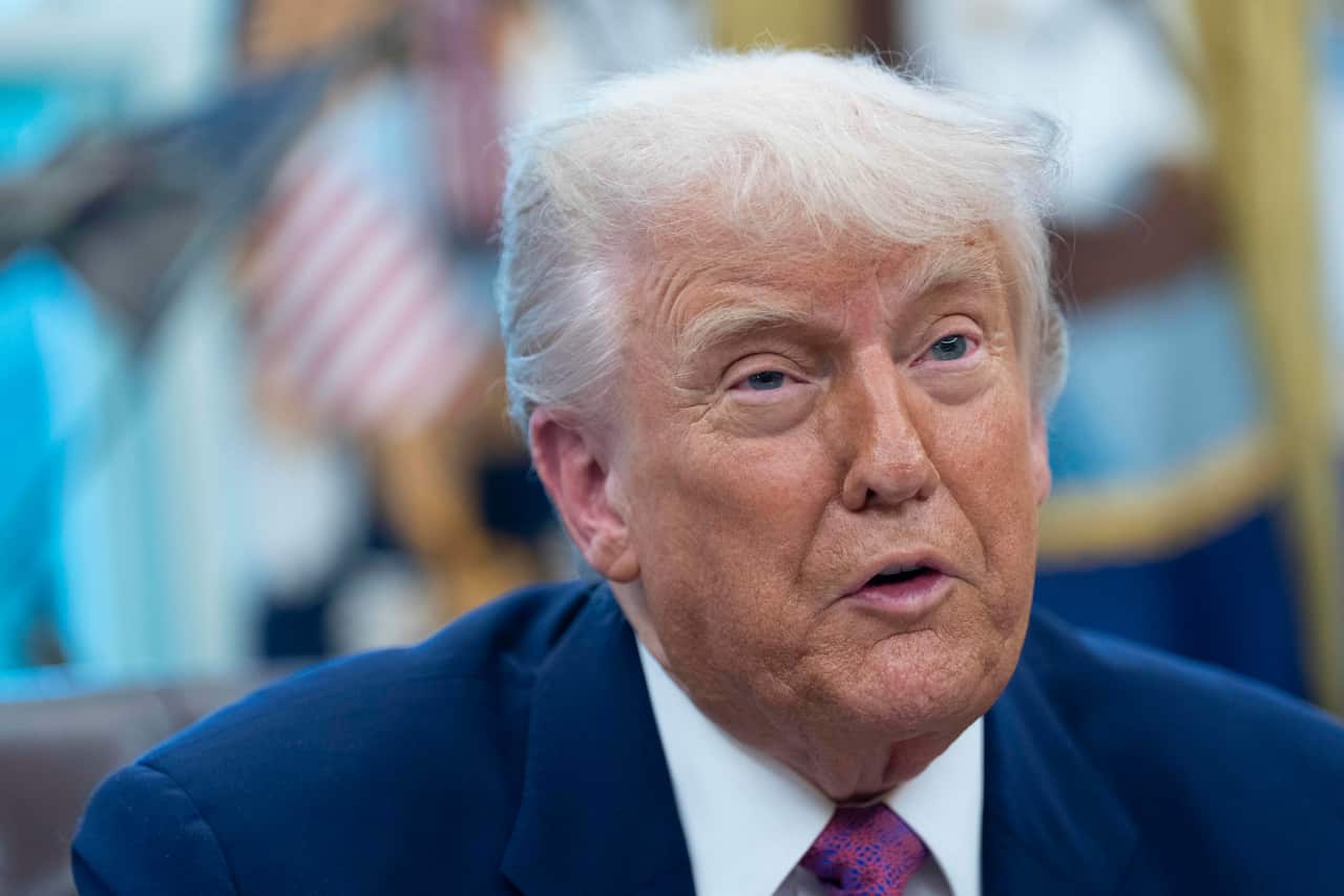 Donald Trump sitting in the Oval Office.