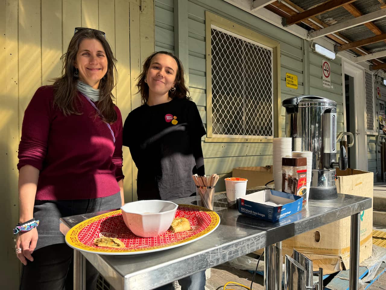 Olivia and Amal welcome customers at the low-cost grocery store on Addi Road with coffee, tea and snacks.