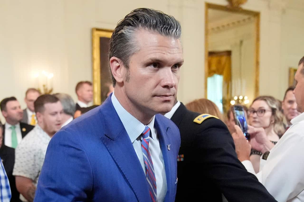 A man in a blue suit in the White House