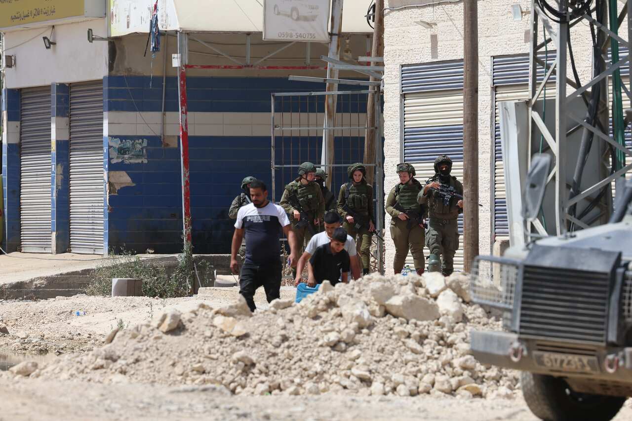 Palestinians try to reach their houses near Tulkarem