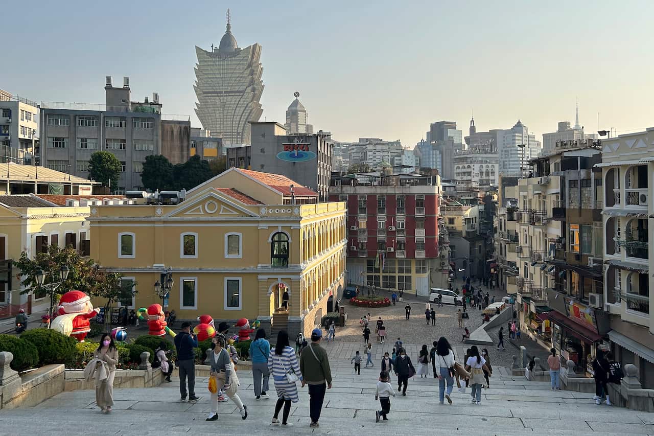 Tourists enjoy unusual tranquility at the historic site Ruins of St. Paul’s in Macao on Dec. 28, 2022. Gambling haven Macao’s relaxation of border restrictions after China rolled back its "zero-COVID" strategy is widely expected to boost its tourism