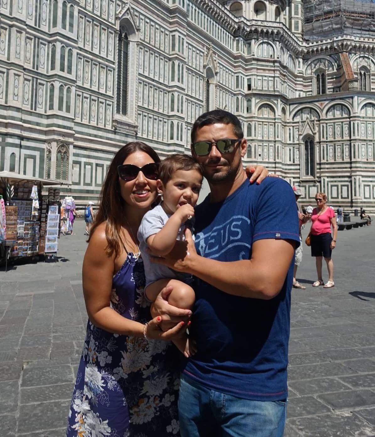 Grace with her husband Franco and their child in front of the Duomo in Florence.
