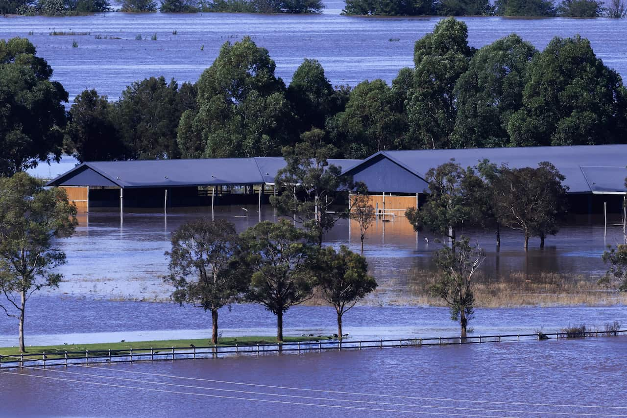 Stables flooded halfway by rainfall.