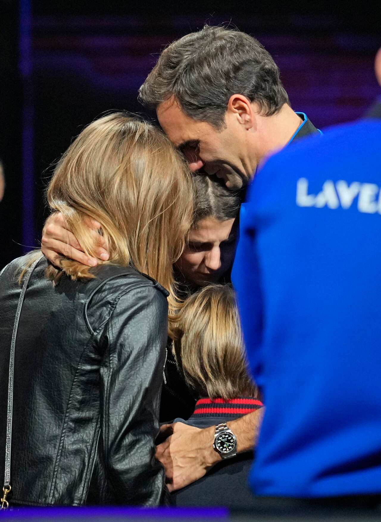 Roger Federer of Team Europe embraces his wife Mirka and their children after playing with Rafael Nadal in a Laver Cup doubles match against Team World's Jack Sock and Frances Tiafoe.