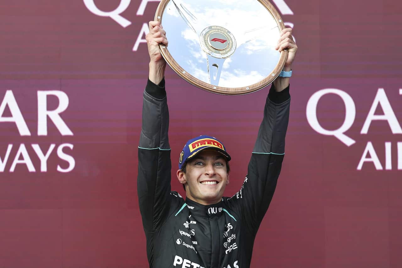 MELBOURNE, AUSTRALIA - MARCH 8: George Russell of Great Britain of Mercedes AMG PETRONAS F1 Team celebrates with race trophy after winning the F1 Grand Prix of Australia at Albert Park Circuit on March 8, 2026 in Melbourne, Australia.