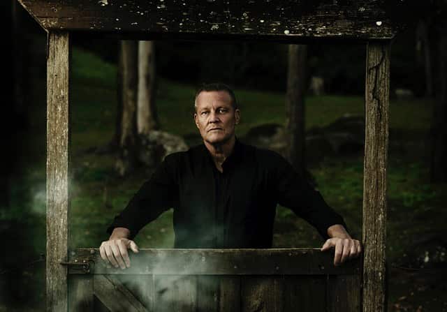 Bill Edgar in a graveyard