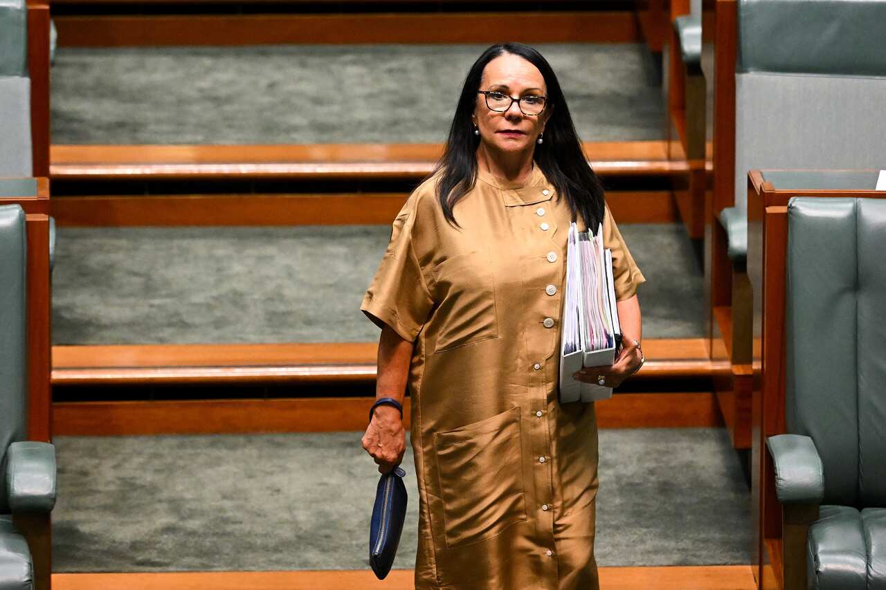 Linda Burney walking in the House of Representatives.