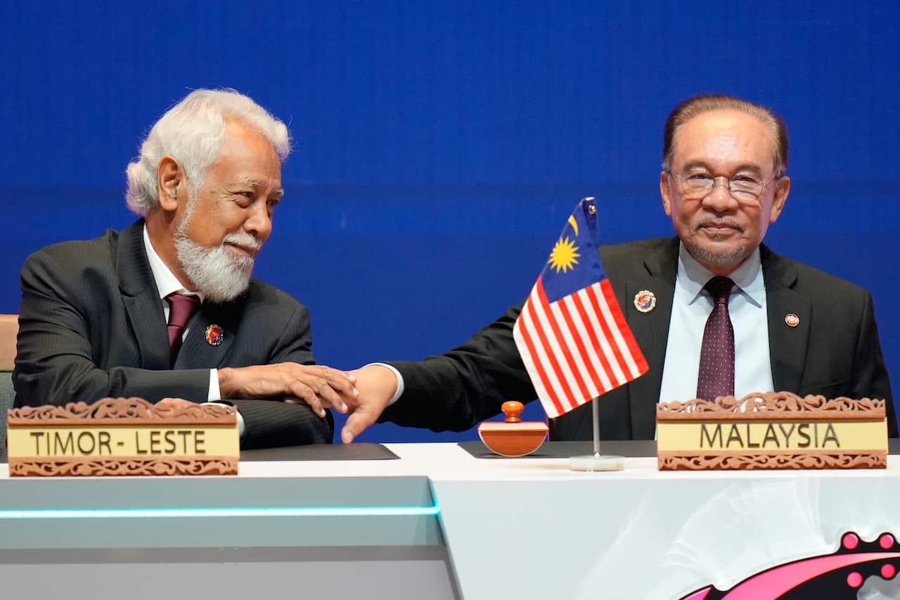 Malaysia's Prime Minister Anwar Ibrahim, right, greets East Timor's Prime Minister Kay Rala Xanana Gusmao