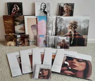 A pile of albums and vinyls. 