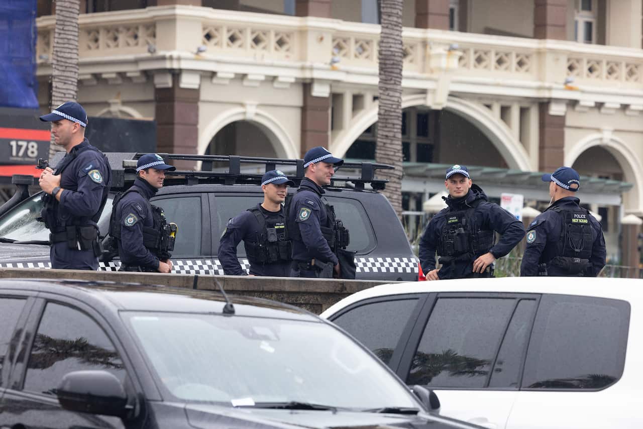 A group of police officers in a carpark 