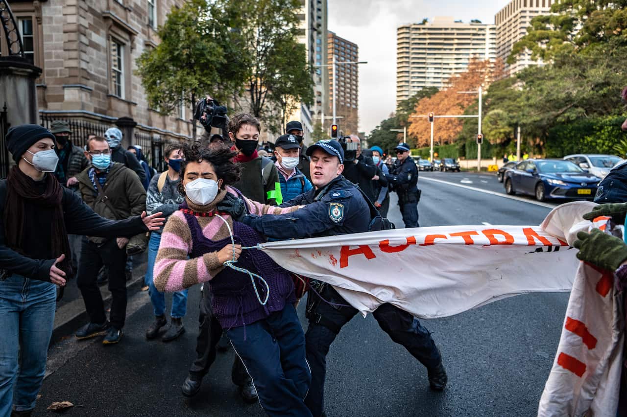 Police throwing protester