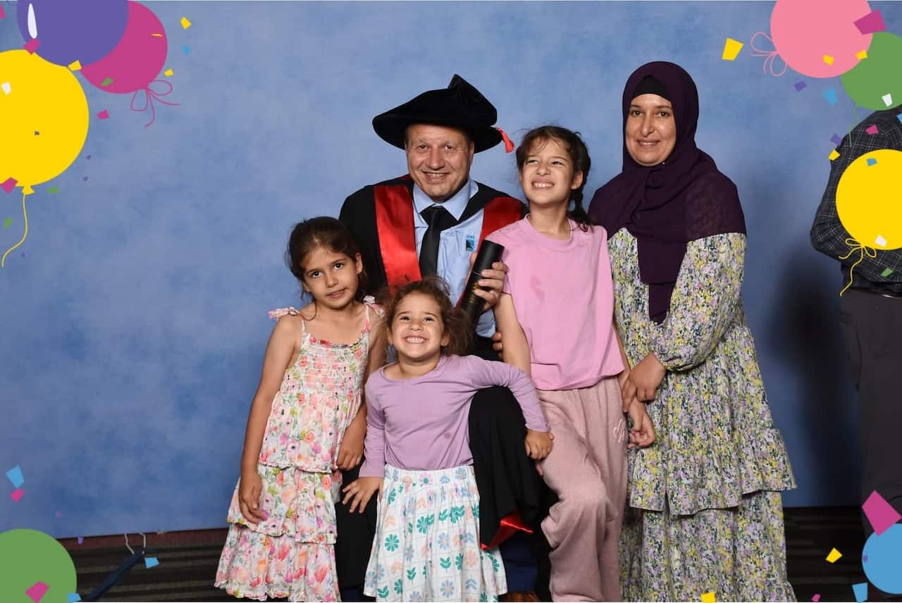 Ayman Hamzah Photo with Family.JPG