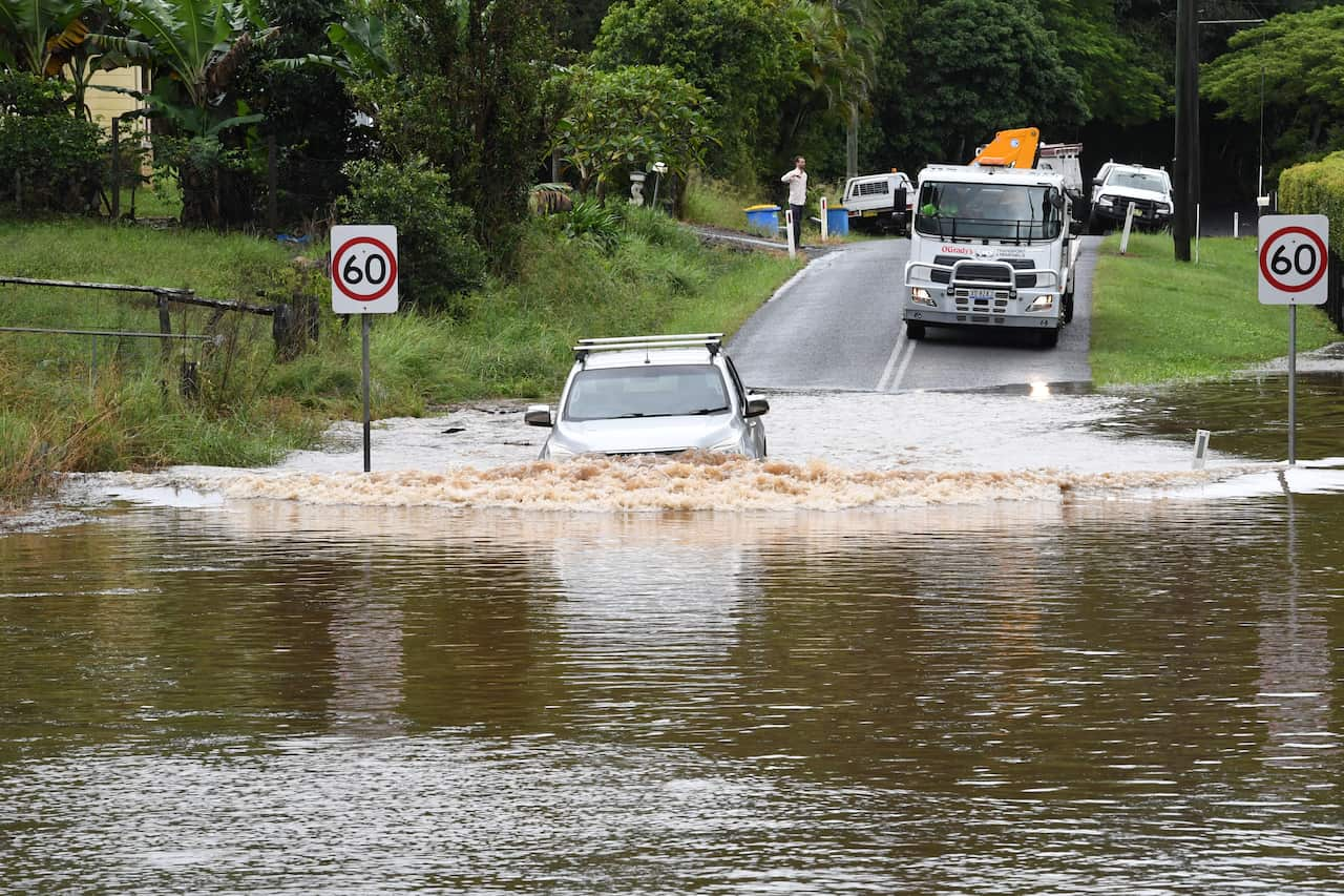 A car trapped in flood waters after attempting to drive through,