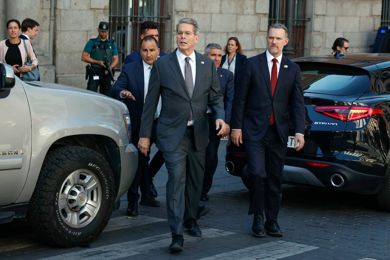 US Treasury Secretary Scott Bessent walking along a street