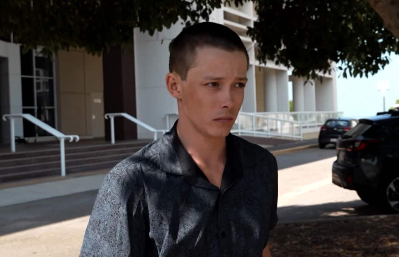 A man in front of a court house