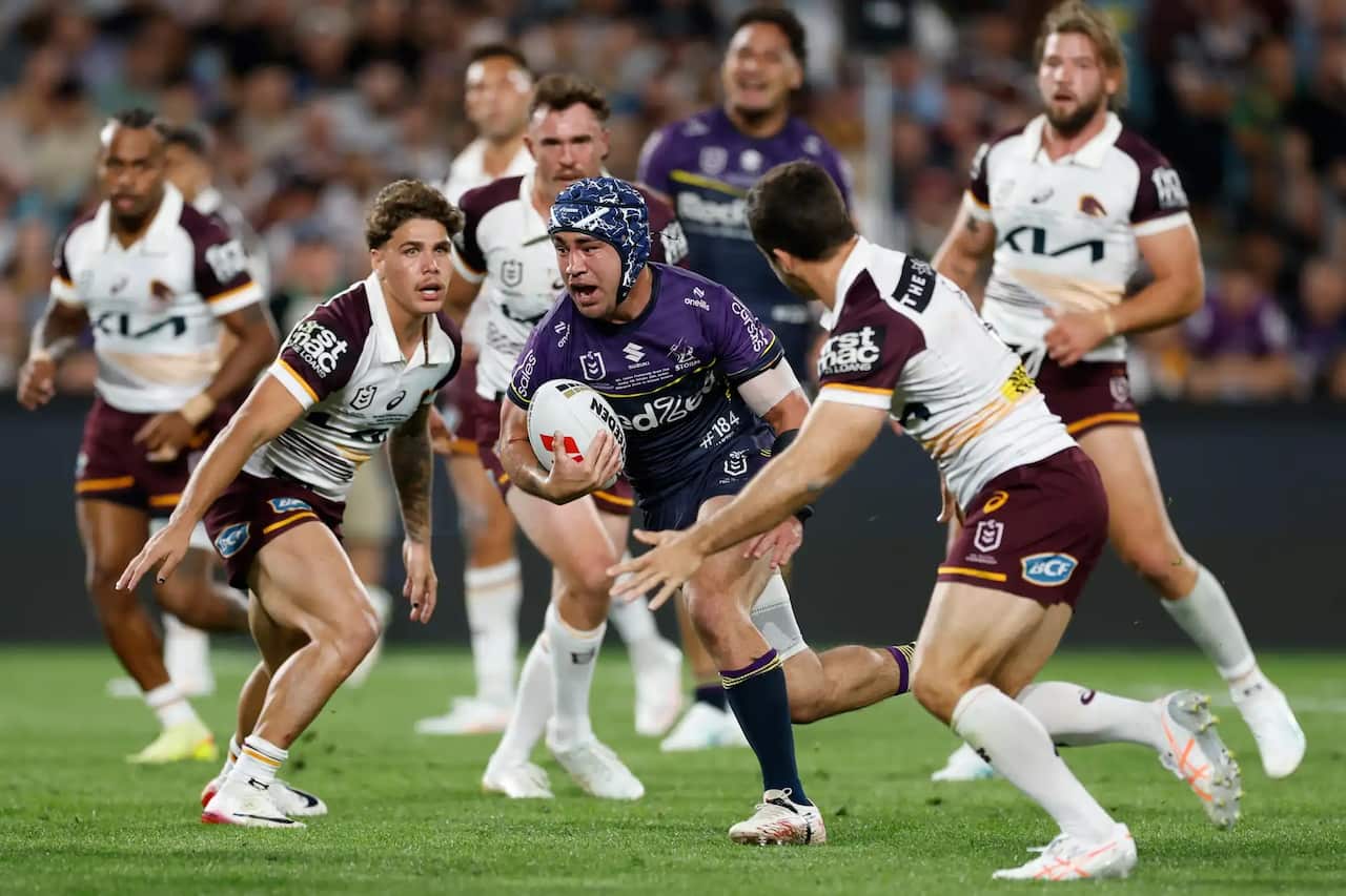 Jahrome Hughes makes a break to score a try for the Storm..jpg