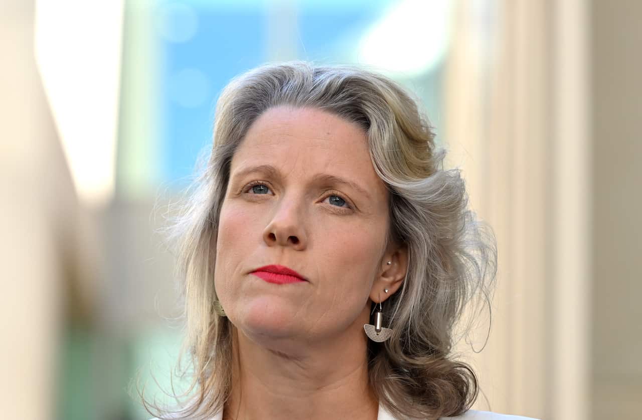 A woman with light blonde hair.