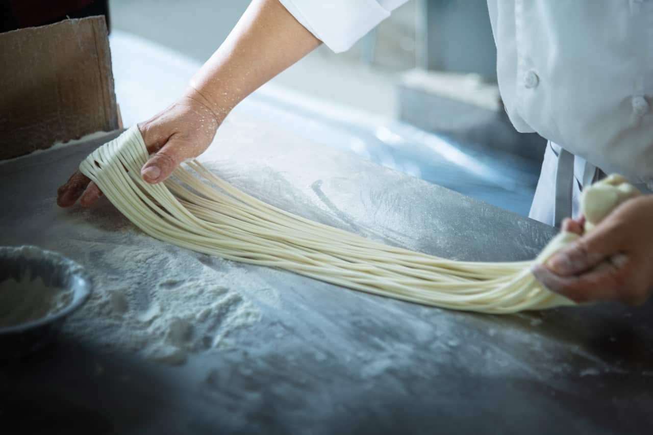 Chef is making handmade noodles