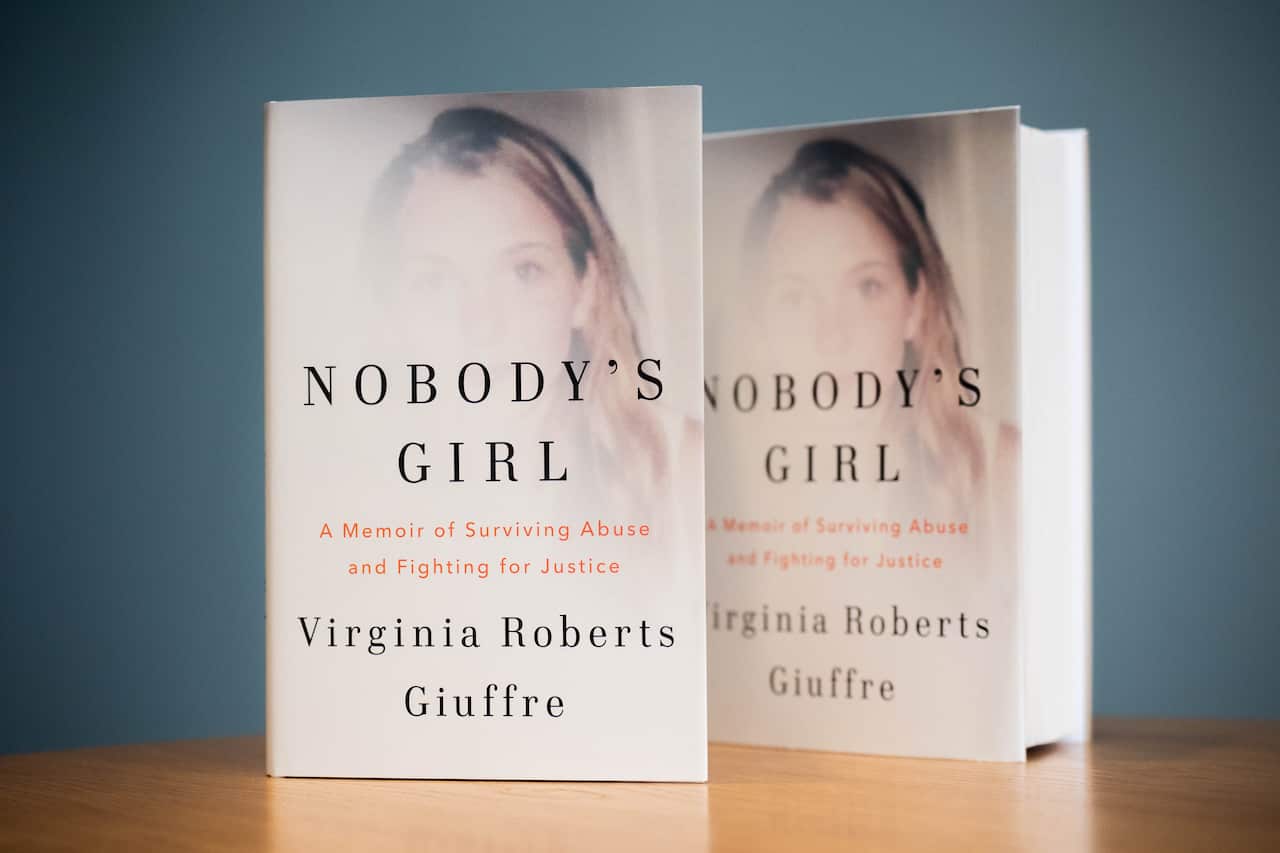 A book on a desk facing with the cover towards the camera.