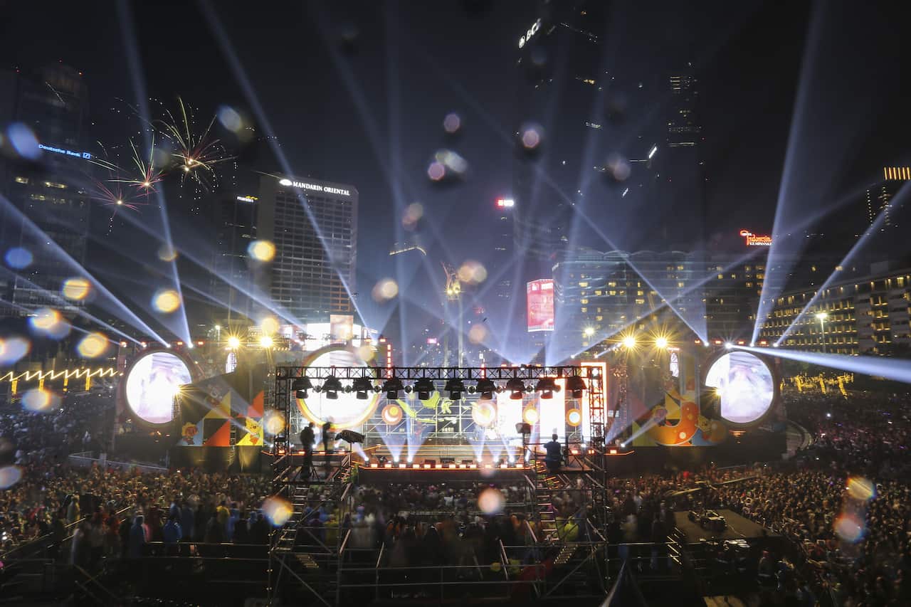 Light show over crowd of people.