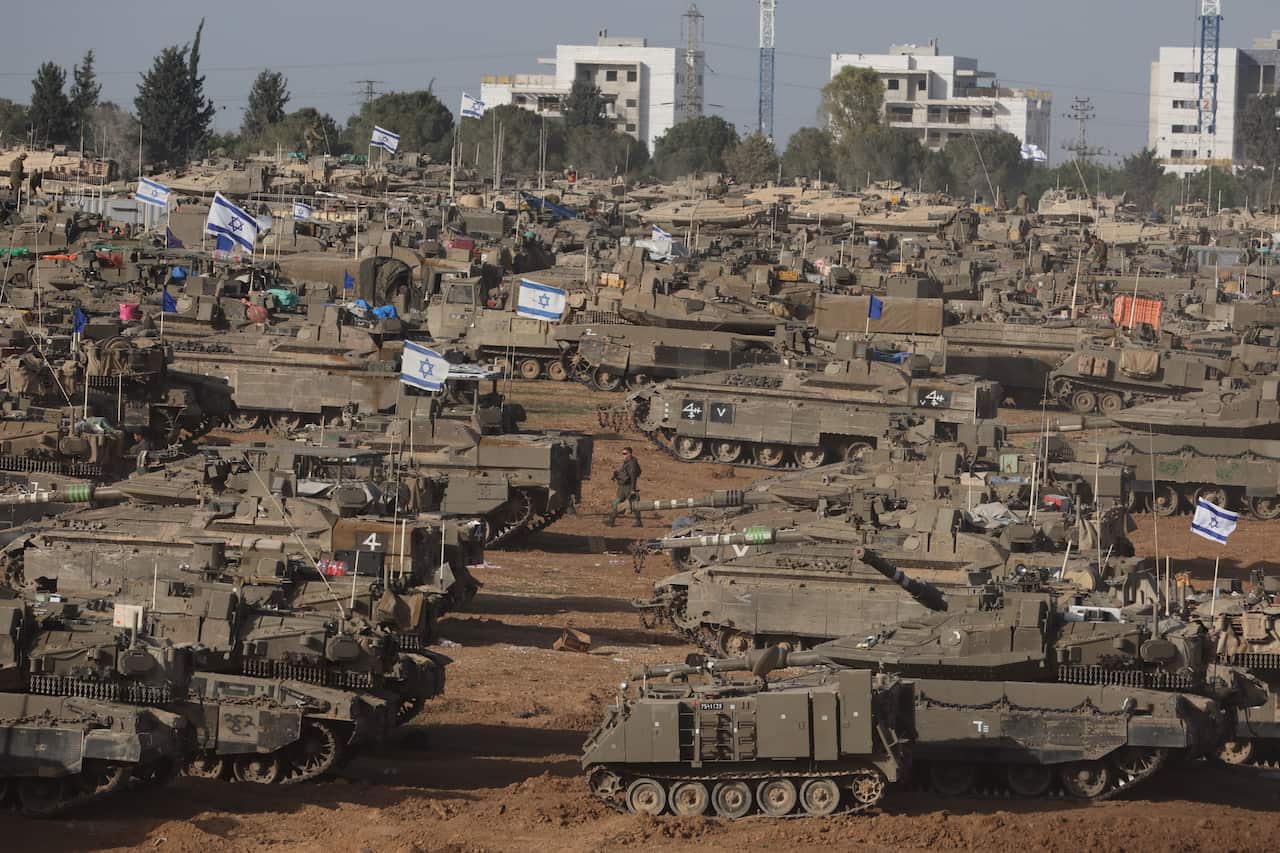 Israeli troops gather near the Gaza border, southern Israel