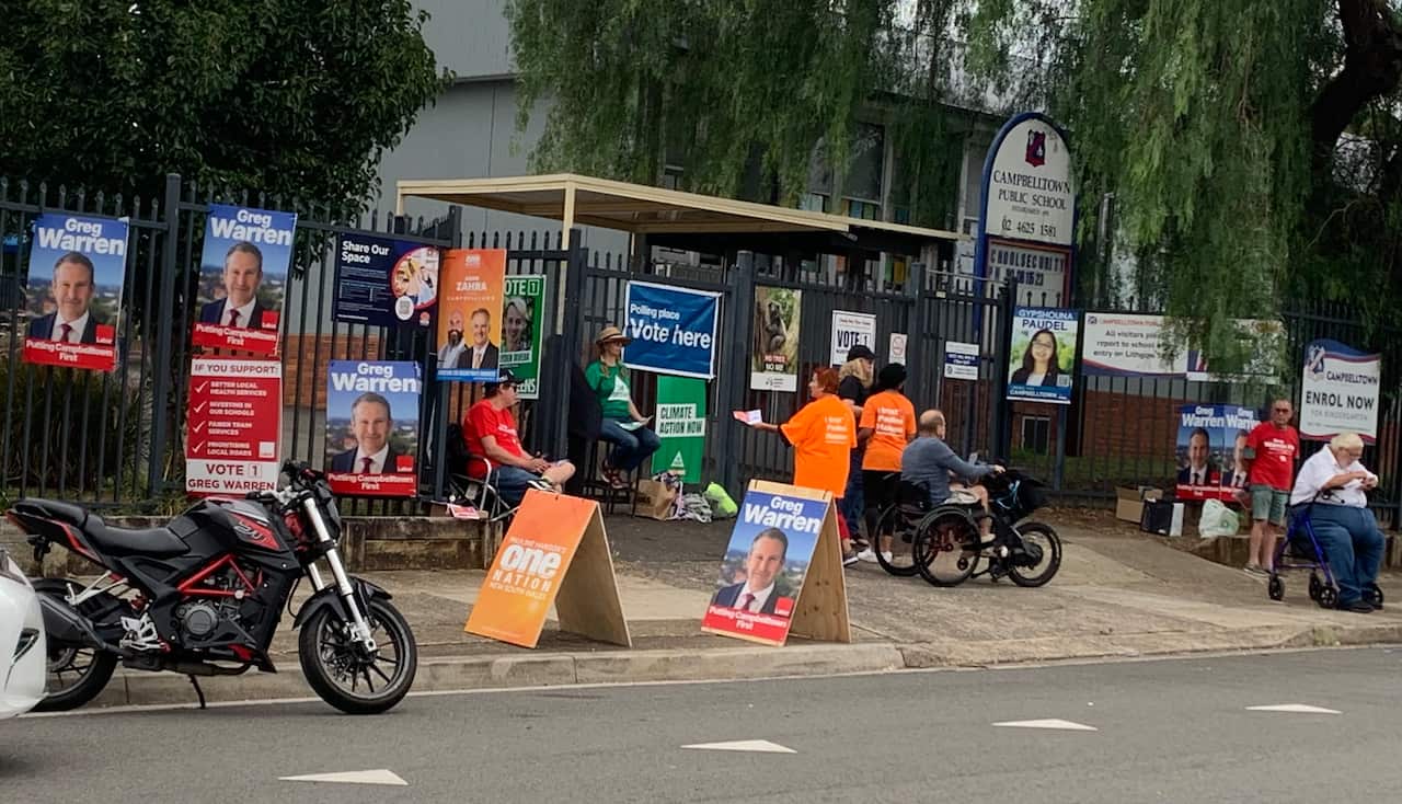 Volunteers seen at Campbelltown voting centre.