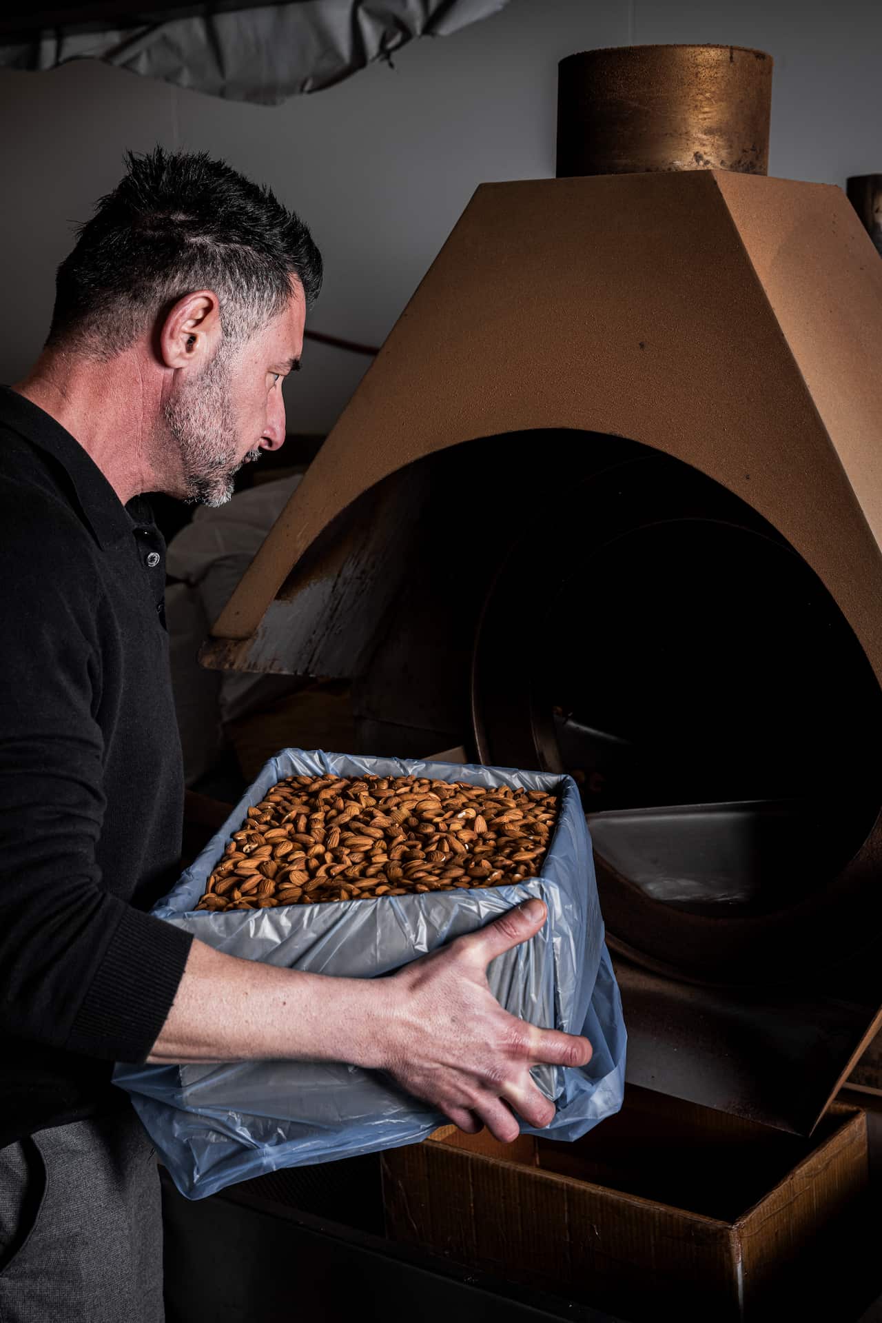 Mohamed Afiouny roasting and packing a batch of nuts. 