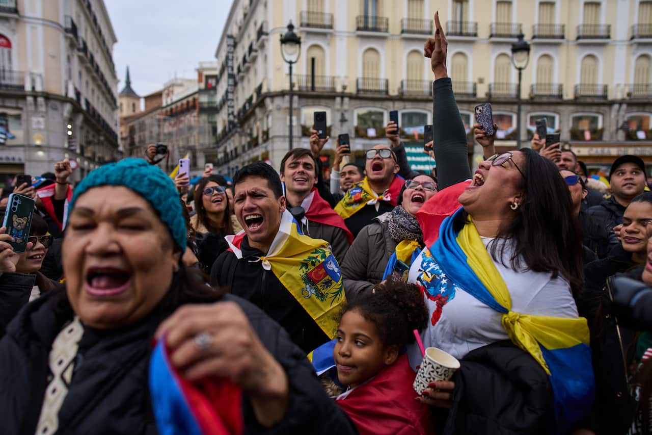 A crowd of Venezuelans celebrate in Madrid