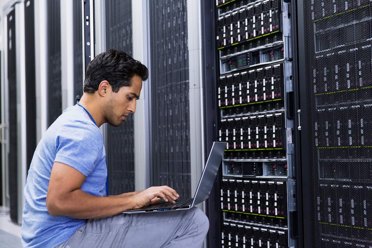 people working in modern server room